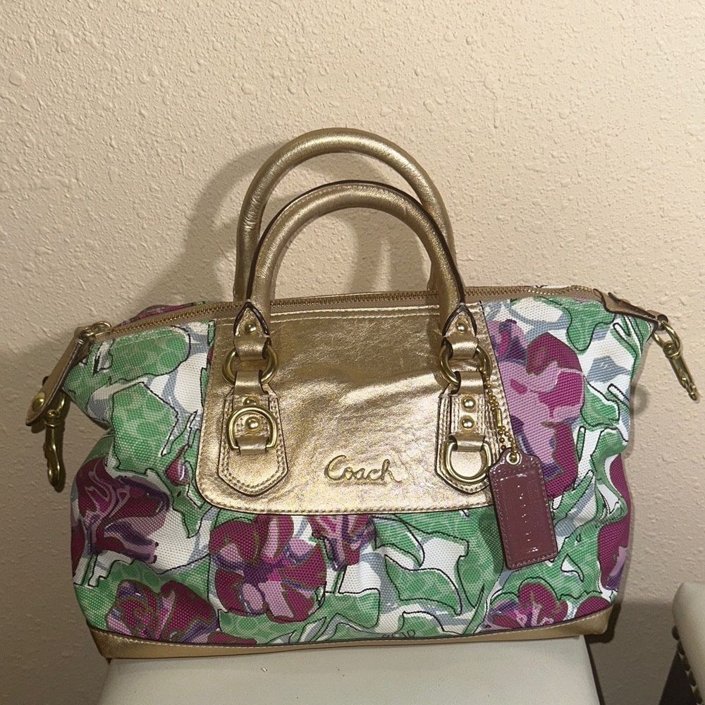 This is a Coach Ashley Floral IRIS Canvas and Metallic Gold Leather Satchel